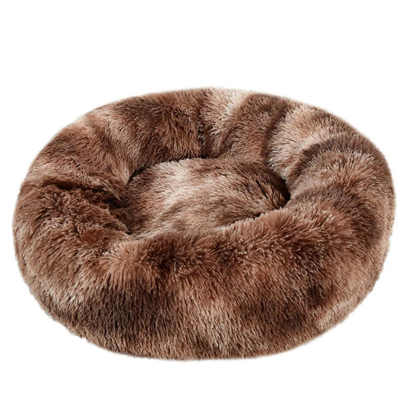 Brown faux fur donut pet bed on a white background