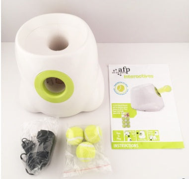 "AFP All for Paws interactive automatic dog ball launcher with tennis balls and instruction manual."