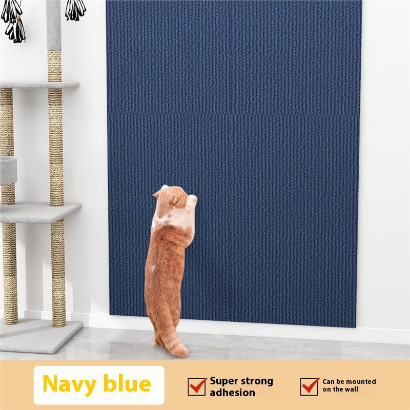 Navy blue textured wall panel with a cat standing on a white floor, next to a cat tree.