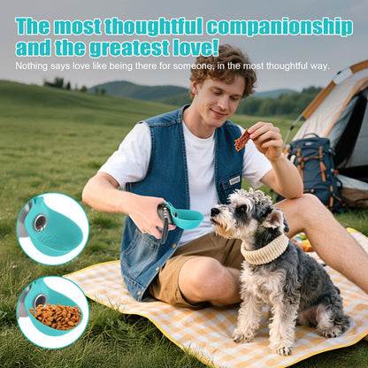 Man sitting on a blanket with a dog, holding a treat, with camping gear in the background.