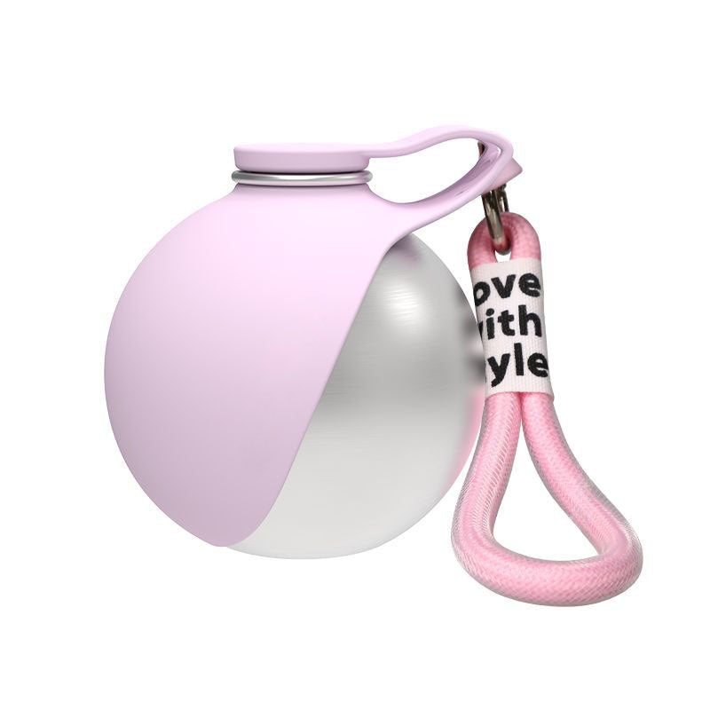 Two-toned pink and white ball with a pink keychain on a white background
