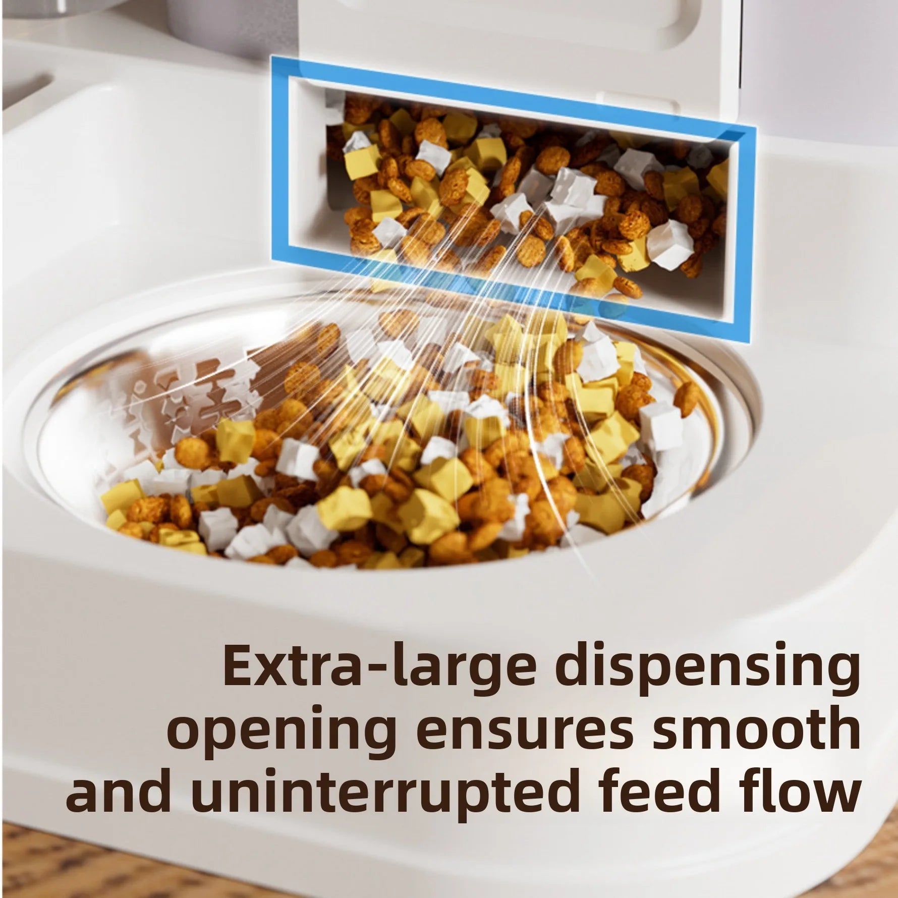 Close-up of a pet food dispenser with text highlighting its large dispensing opening.