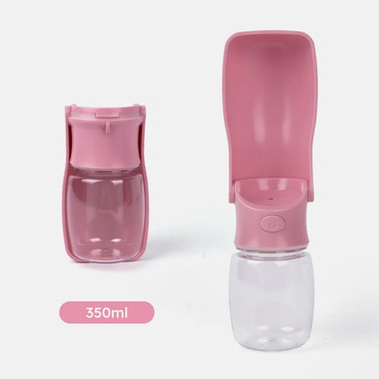 Pink portable water bottle with a detachable nozzle on a white background