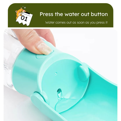 Turquoise handheld water bottle with a button being pressed, showing water coming out.