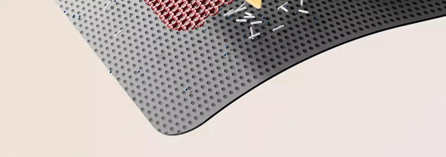 Gray textured mat with a small red object on a beige surface