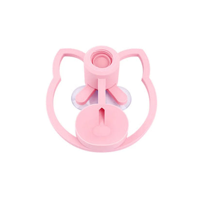 Pink baby bottle lid with a unique design on a white background