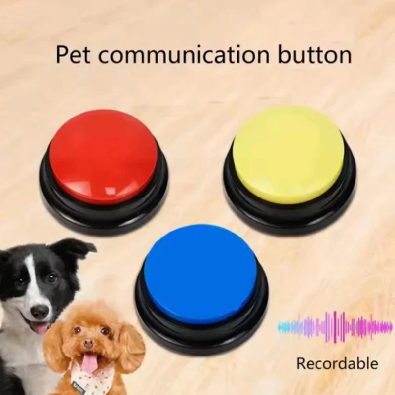 Three colorful buttons for pet communication on a wooden background with two dogs and text.