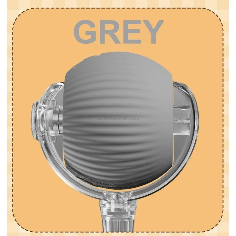 Gray shower head on a beige background with 'GREY' text