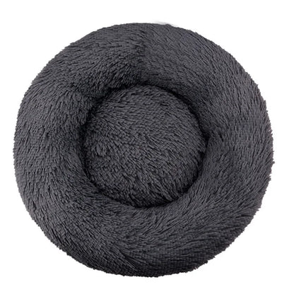 Coiled gray skein of yarn on a white background