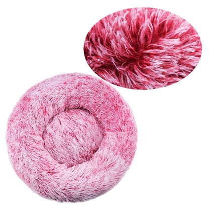 Pink fluffy yarn ball with close-up on a white background