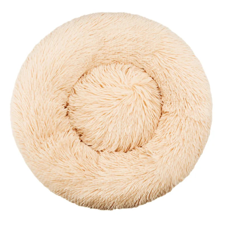 Beige fluffy ball of yarn on a white background