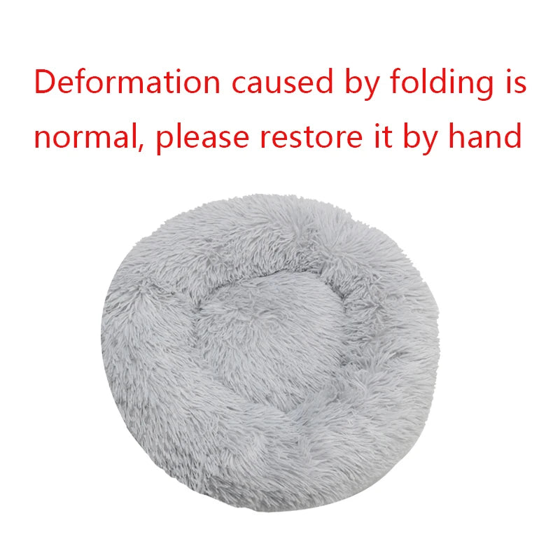 Fluffy gray pet bed with text indicating deformation caused by folding.