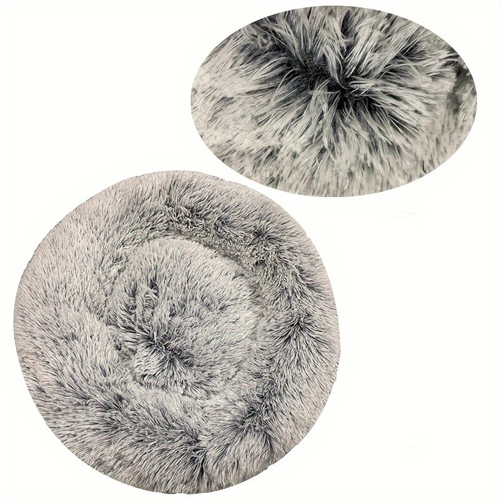 Two gray fluffy round mats on a white background