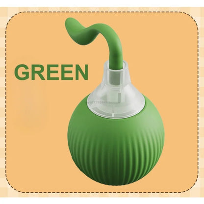 Green ball with a straw-like structure on a beige background