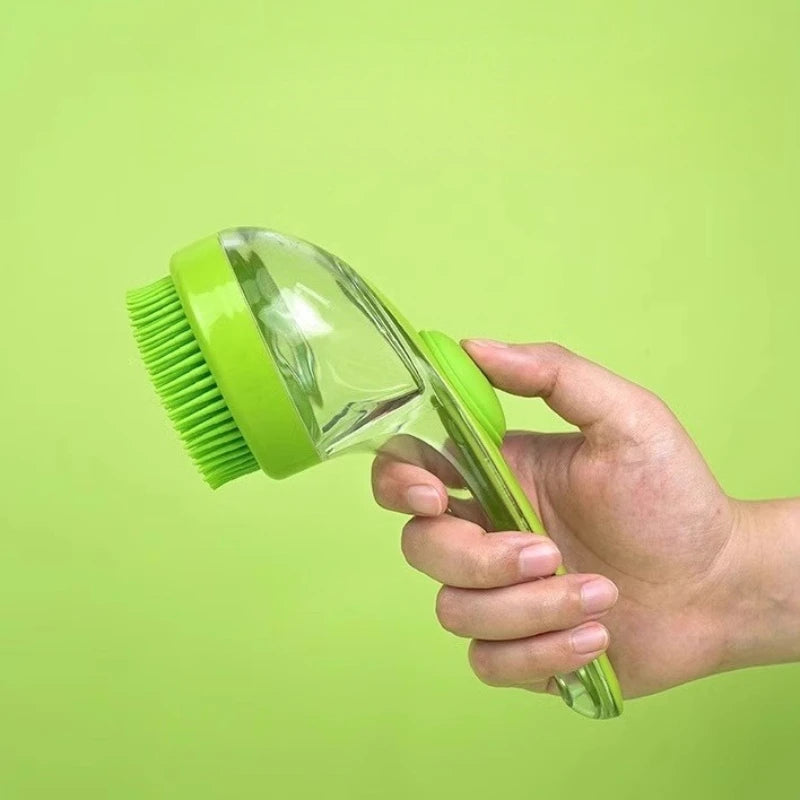 Hand holding a green and clear cleaning brush against a green background
