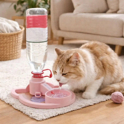 Cat drinking water from a pink pet fountain in a living room setting.