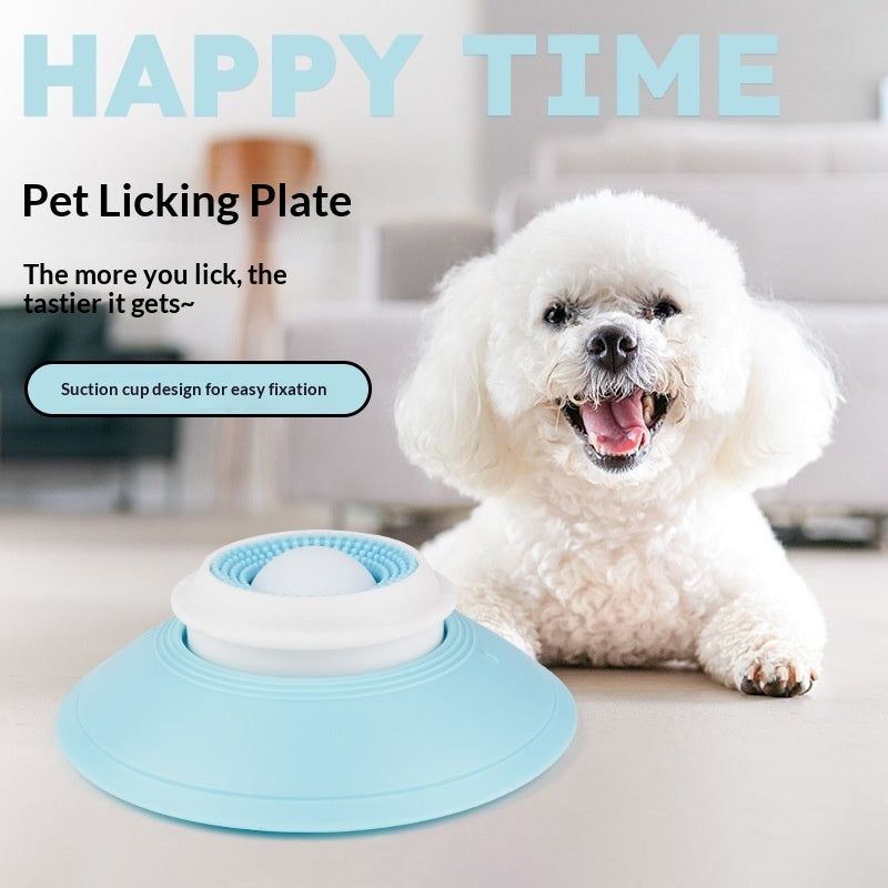 Pet licking plate with a dog licking it, set against a blurred indoor background.