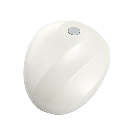 White spherical night light with a button on a white background